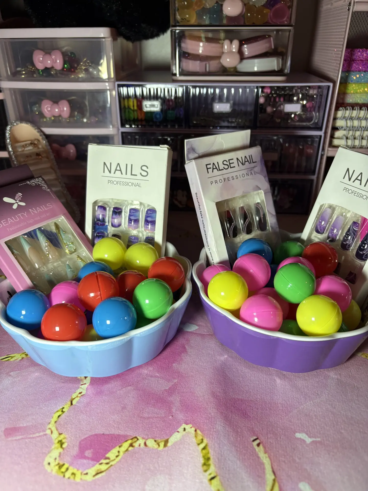 Colorful gumballs and false nails display.